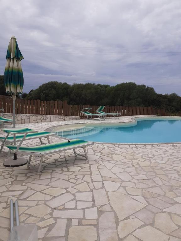 agriturismo gli olivastri appartamento raggio di sole , con piscina e vista mare ,climatizzatore,wifi - B&B Aglientu
