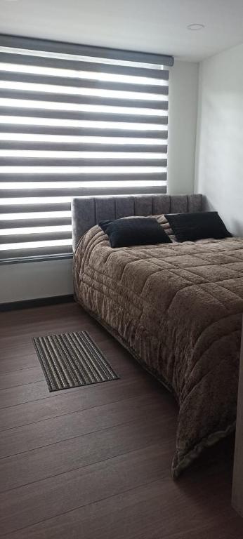 Elegancia Urbana: Aparta Estudio - Chambres d'hôtes Pasto