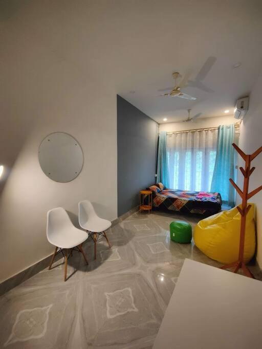 White Minimalist Room - B&B Jorhat
