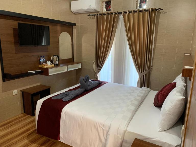 Tirtasuci House - Chambres d'hôtes Kuta