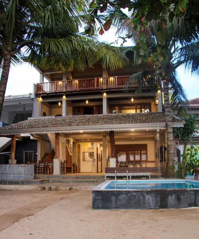 Pearl Divers Beachfront Apartment - Chambres d'hôtes Unawatuna