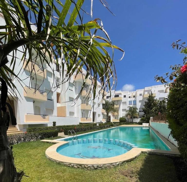 Joli appartement balnéaire avec piscine - B&B Tánger