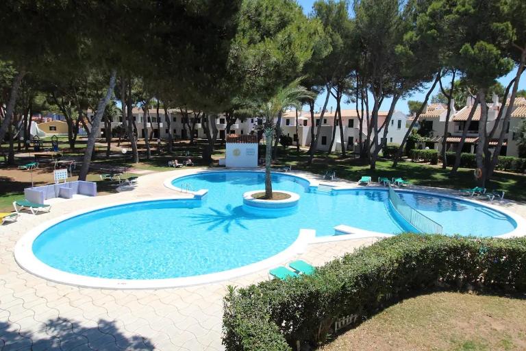 Apartamento Playa Xoriguer con piscina y jardin - Chambres d'hôtes Son Xoriguer