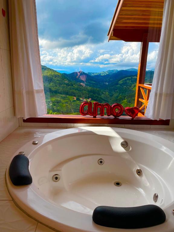 Chalé 2 hidromassagem lareira e cozinha - Chambres d'hôtes Gonçalves