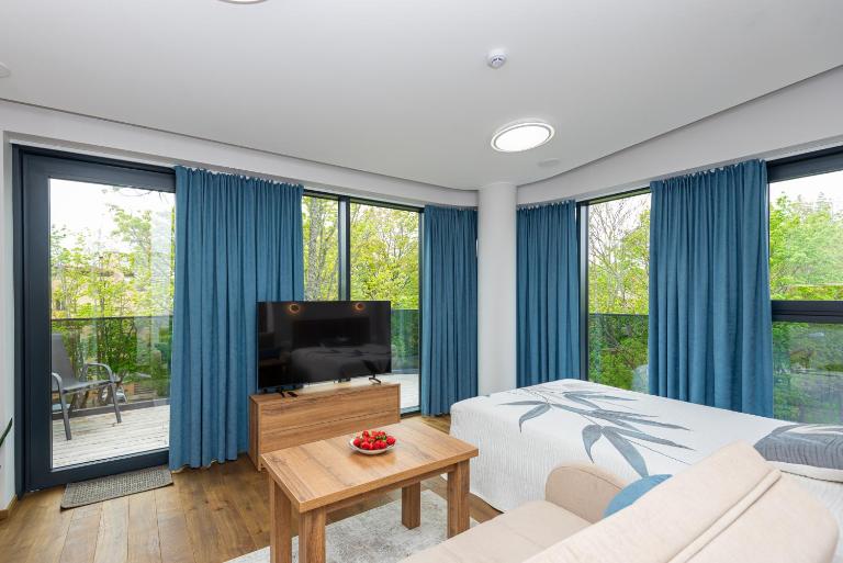 Saulėti Studio apartamentai su Terasa - Chambres d'hôtes Palanga