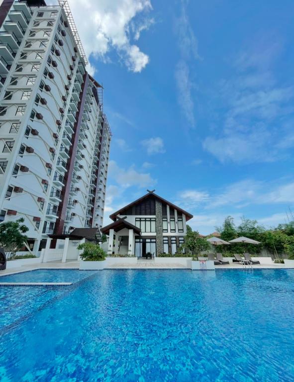 The Cozy Room with Pool Access Studio Unit 1BR - Chambres d'hôtes Lapu-Lapu City