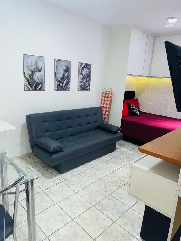 Sala living em prédio Familiar na Av da Praia - Chambres d'hôtes Santos