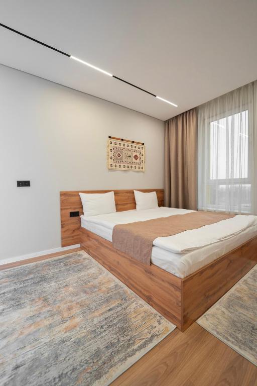 Q Apartment - Ferienwohnung Almaty