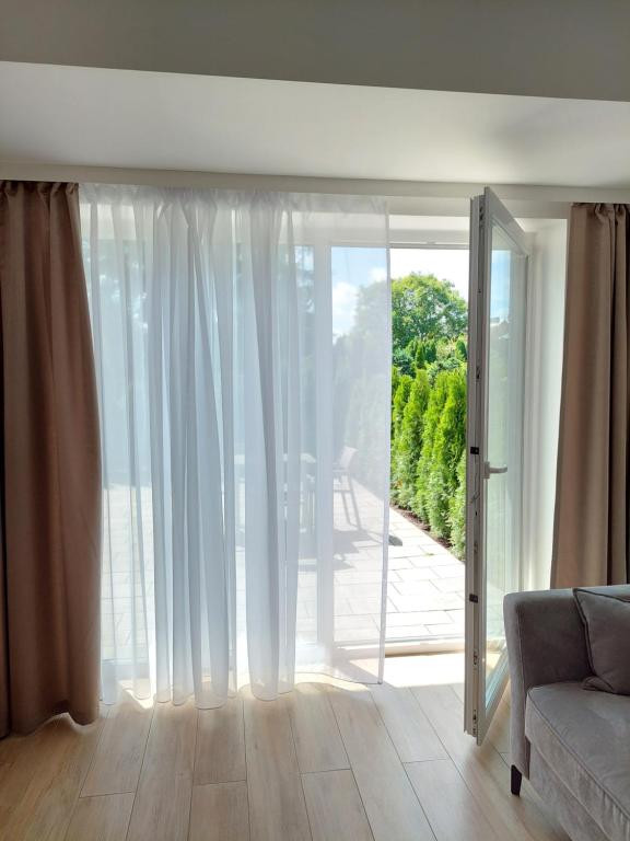 Apartament z tarasem A04 w Welle - Bed and Breakfast Grzybowo