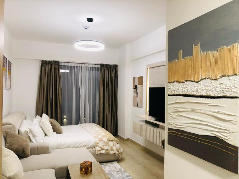 PANTHEON ELYSEE III Elite Apartment Spacious luxury stay with huge pool , modern gym and Complimentary welcome pack - B&B Dubái