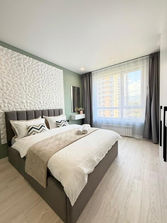 Двухкомнатная квартира с дизайнерским интерьером и видом на горы - Ferienwohnung Almaty