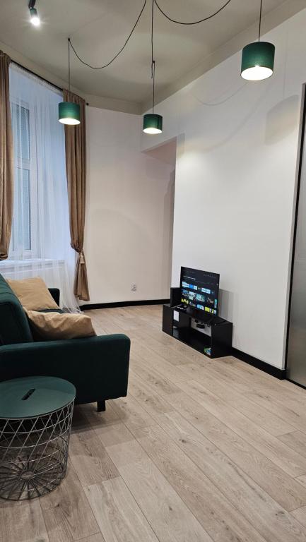 Apartament POD MURALEM - Ferienwohnung Łódź
