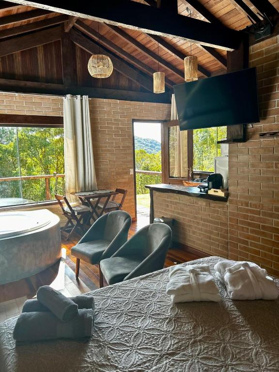 Chalés Retiro dos Manacás - Bed and Breakfast Sapucaí-Mirim