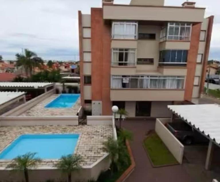 Aconchegante apartamento 2 dormitórios, sendo uma suíte, com piscina - Bed and Breakfast Capão da Canoa