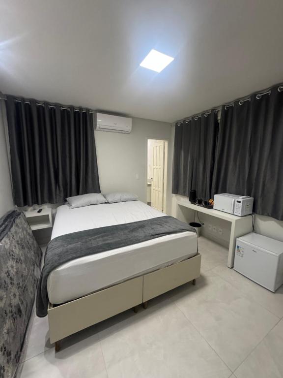 Loft 305B com Ar Condicionado no Bairro Muquiçaba, bem localizado para negócios e fácil acesso para todas as praias e montanhas da cidade - COM vaga de garagem - B&B Guarapari