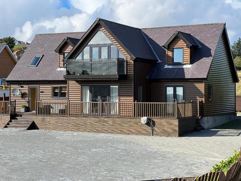 Modern timber clad house - B&B Stornoway