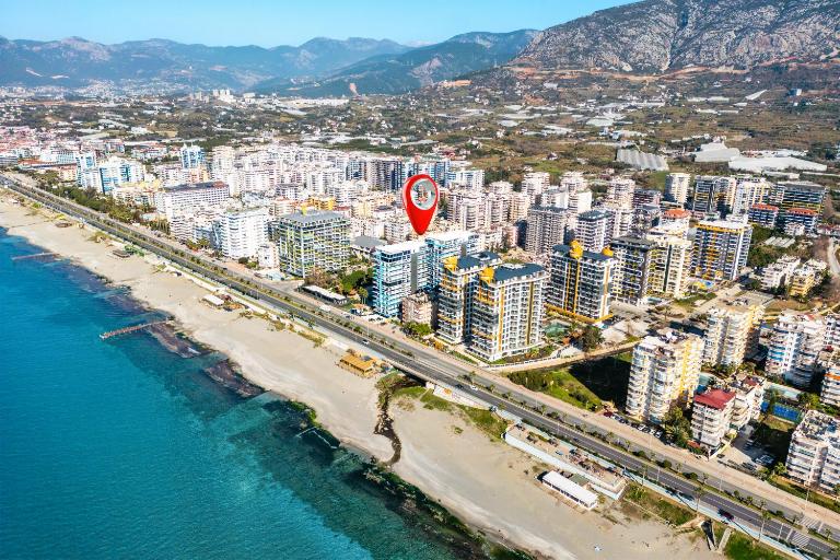 Sea View 1BR Apt - Steps to Beach - Modern Residence - Chambres d'hôtes Alanya
