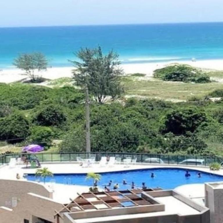 Apartamento em condomínio frente ao mar com piscina - Ferienwohnung Arraial do Cabo
