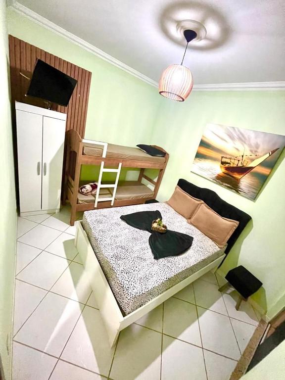 Suíte 102 com TV e banheiro privativo - Chambres d'hôtes Cabo Frio