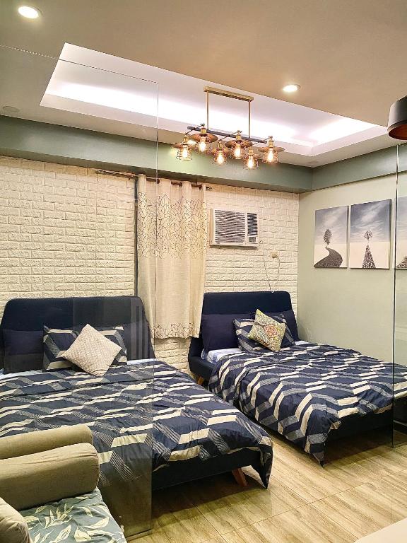 Cozy Escape at McKinley near Venice Grand Canal Mall - B&B Manila