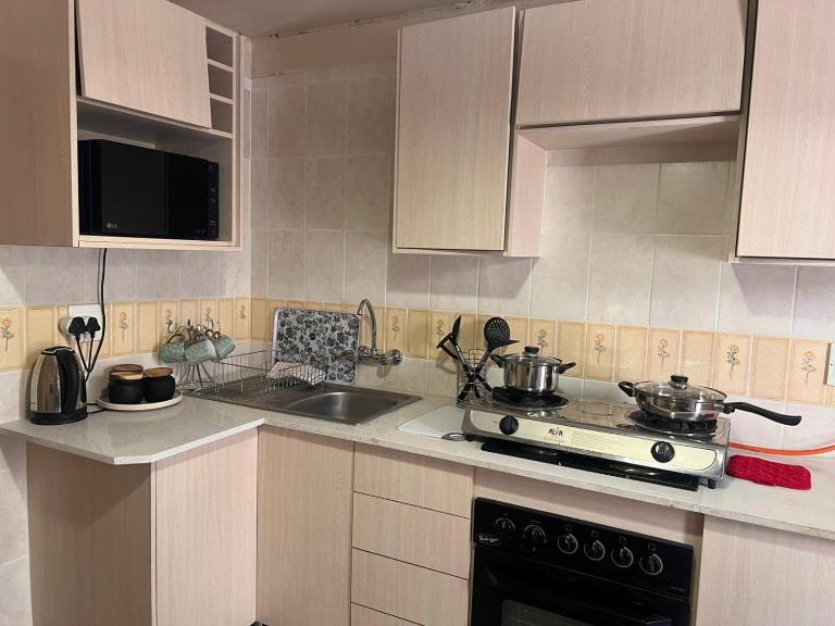 Cozy one bedroom in Kaldi Place - B&B Rustenburg