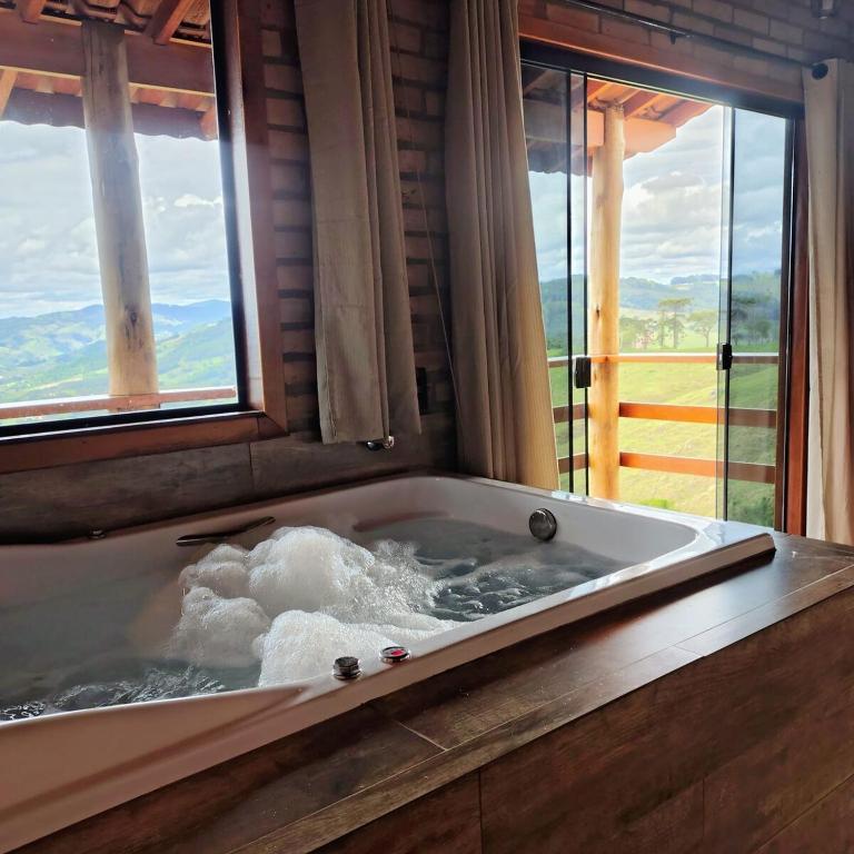 Chalé Canário, no alto da montanha com banheira - Chambres d'hôtes Socorro