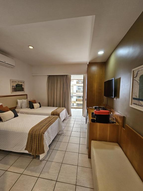 Flat incrível na praia da Barra - B&B Río de Janeiro