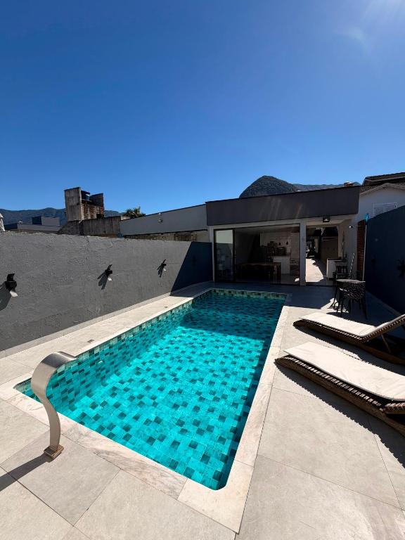 Casa no condomínio morada da praia - B&B Bertioga