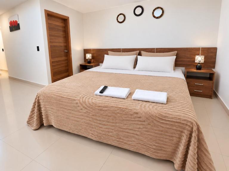 Subsuelo - Suite Matrimonial 3plz con cocina y garage - Ferienwohnung Baños