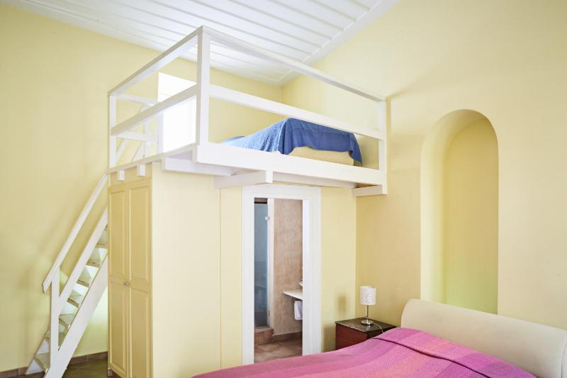 Blue and yellow attic studio image 3