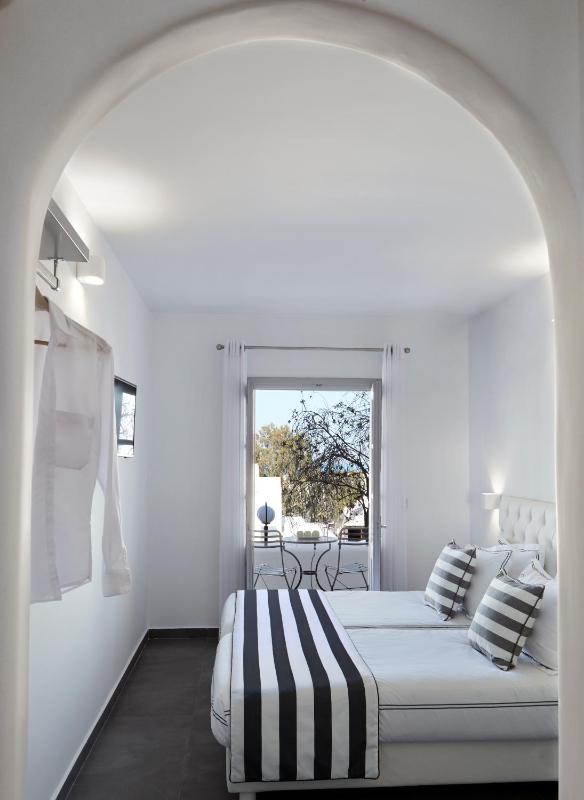 Elegant White Deluxe Room with Private Balcony image 4