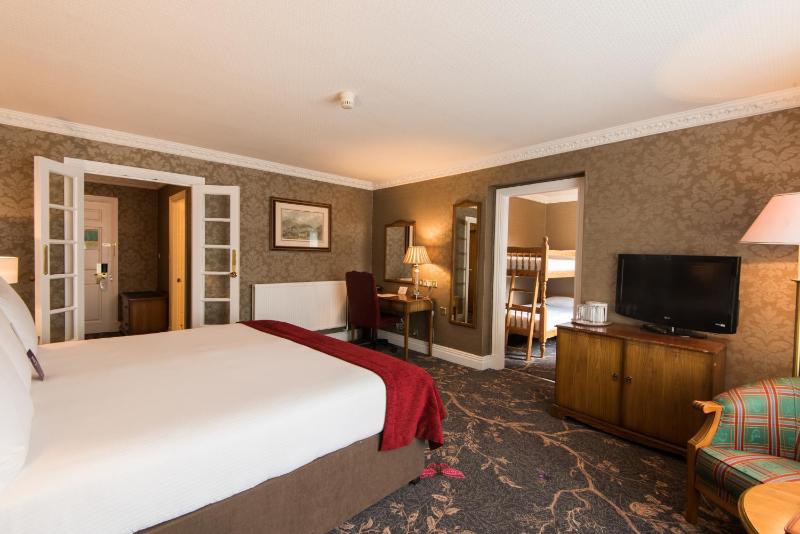 Classic Family Room with One King Bed and Bunk Bed image 1