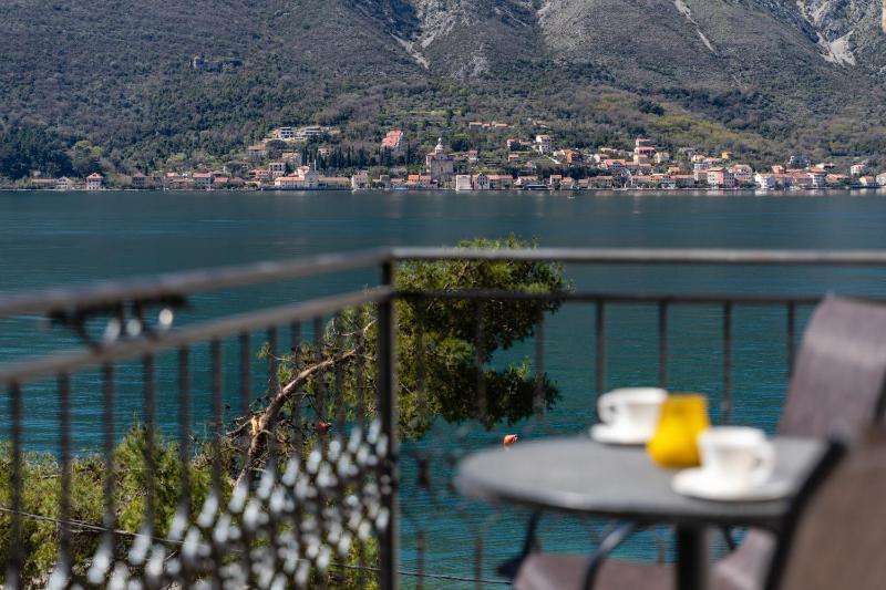 One-Bedroom Apartment with Balcony and Partial Sea View image 1