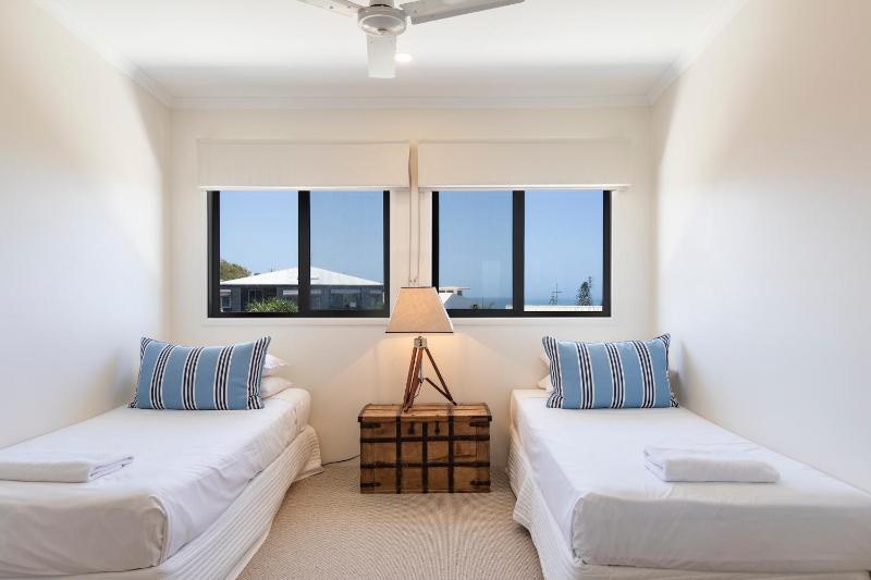 Wake up to ocean views in stylish comfort - image 15