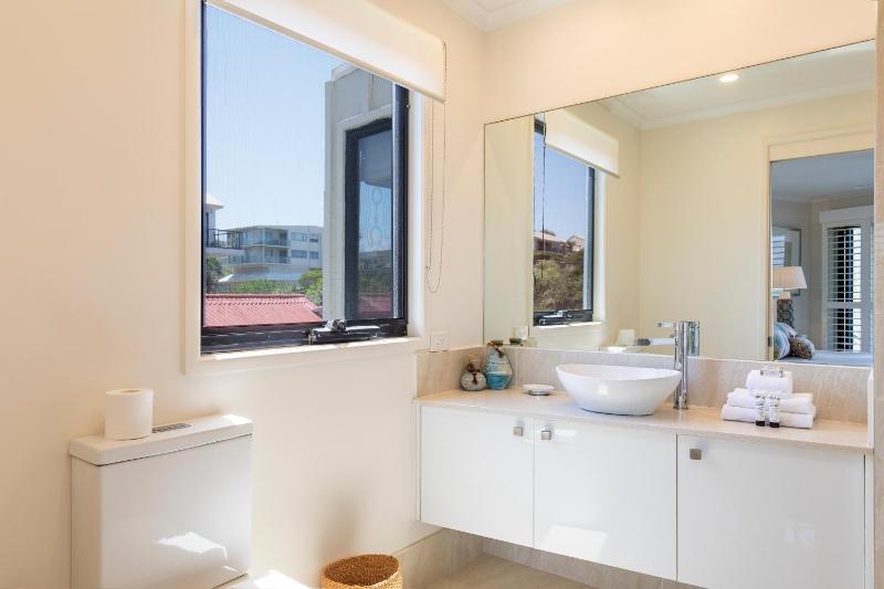 Wake up to ocean views in stylish comfort - image 11