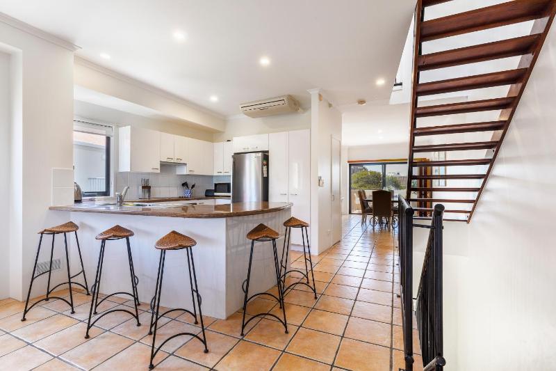 Wake up to ocean views in stylish comfort - image 16