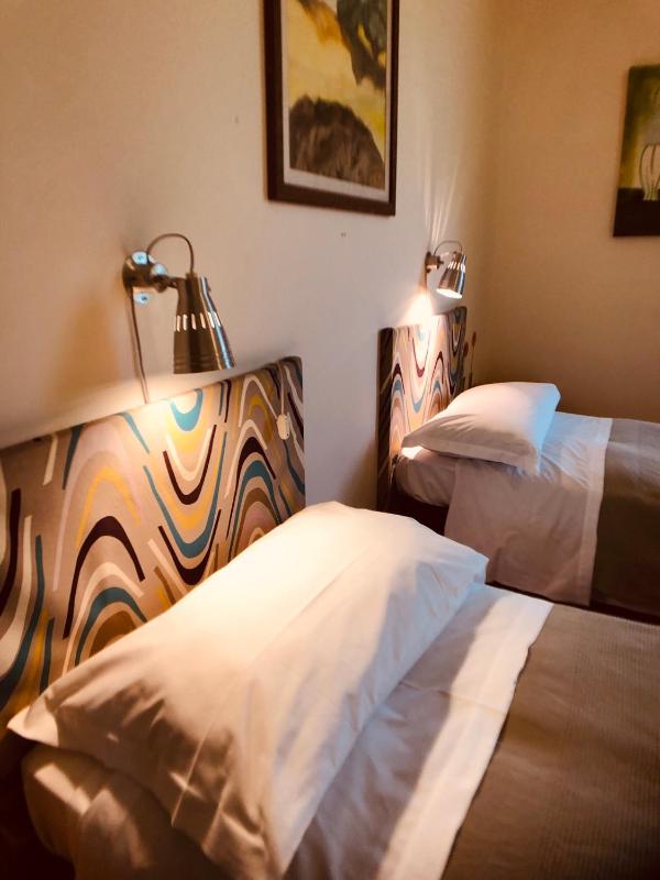 Basic Triple Room with Shared Bathroom image 1