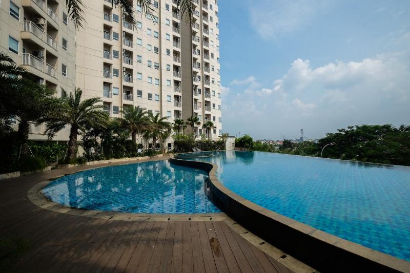Best Location 1BR Apartment Mustika Golf Residence By Travelio - image 2
