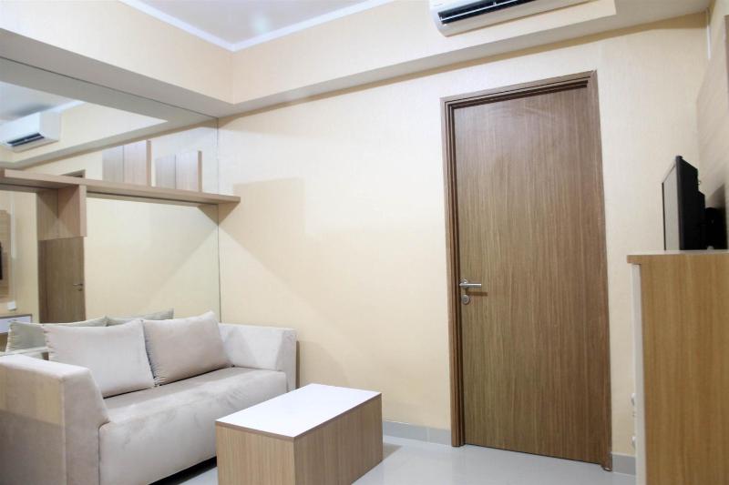 Spacious 1BR at The Oasis Cikarang Apartment By Travelio - image 9