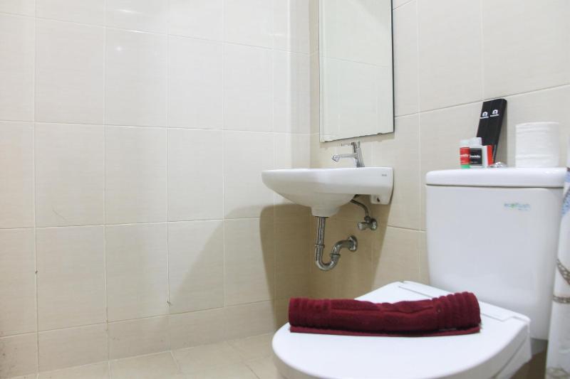 1BR with Extra Balcony The Oasis Cikarang Apartment By Travelio - image 7