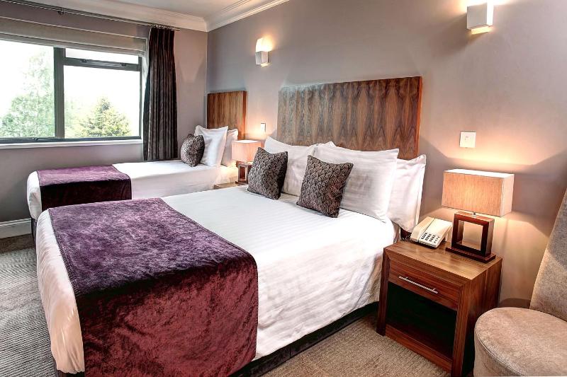 Large Room with One Double and One Single Bed image 1