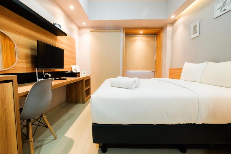 Furnished Studio No Kitchen Apartment Mustika Golf Residence By Travelio - image 4