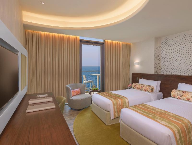 DELUXE ROOM  Partial Sea View, King Bed or Two Single Beds image 2