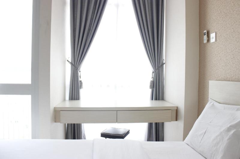 Minimalist Studio Room Taman Melati Apartment Jatinangor By Travelio - image 2