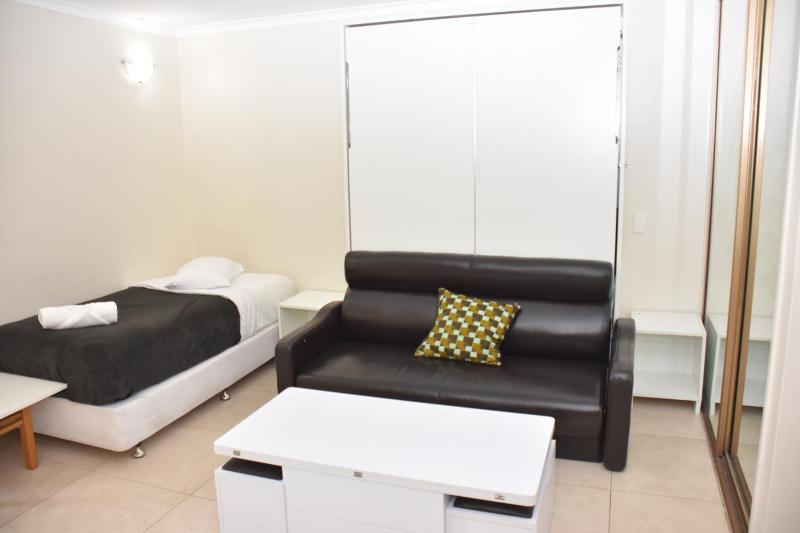 One-Bedroom Apartment with Balcony and City View image 2