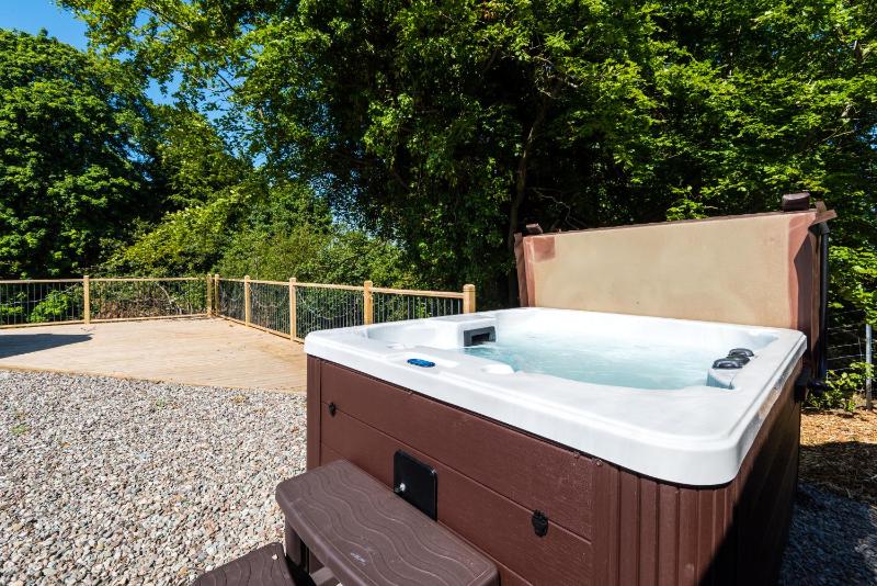 Lodge With Hot Tub image 3