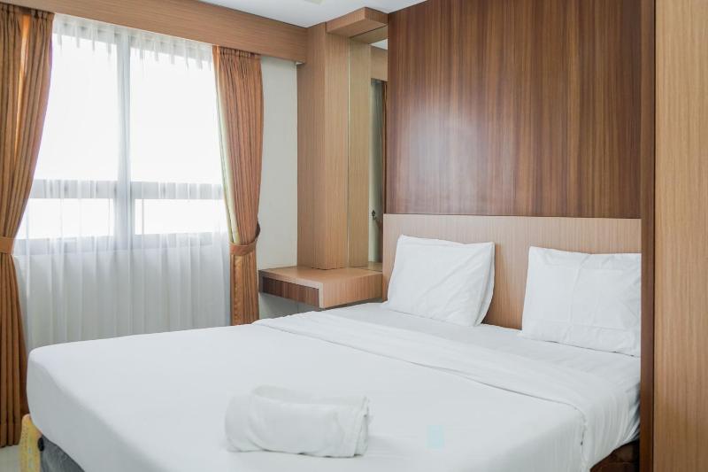 Fully Furnished with Comfortable Design 2BR Apartment Atria Residences By Travelio - image 1