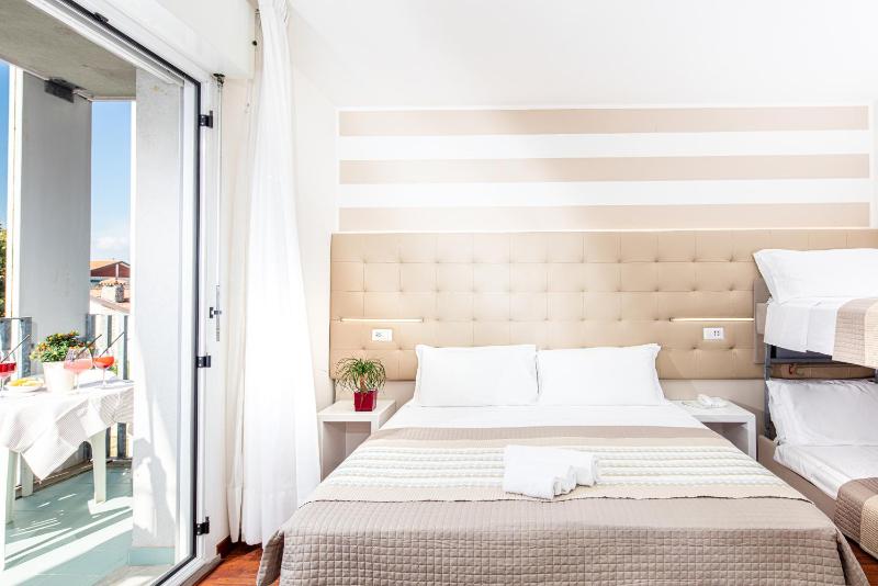Quadruple Room with Balcony image 1