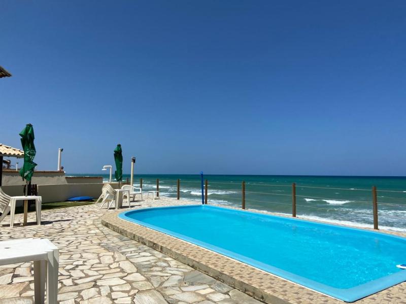 Casa de praia em condomínio à beira mar Images
