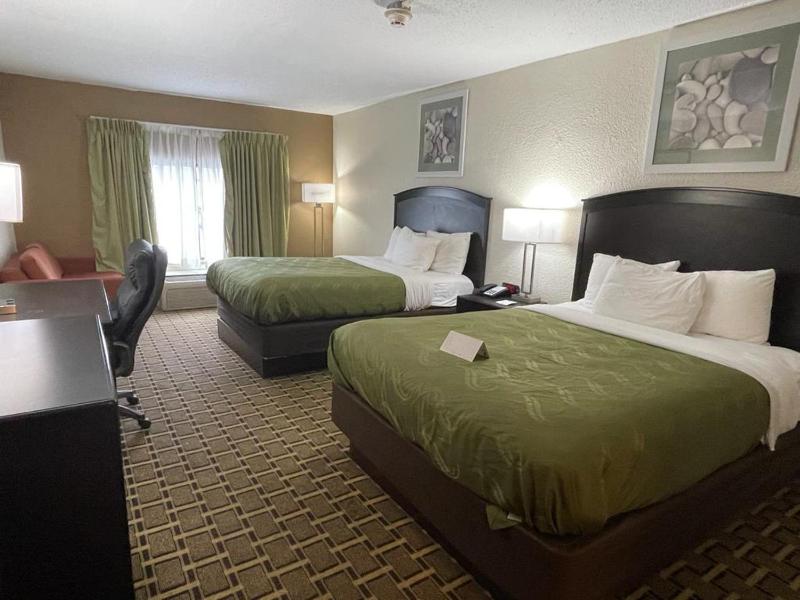 Quadruple Room with Two Queen Beds and Pool View - Non Smoking image 1